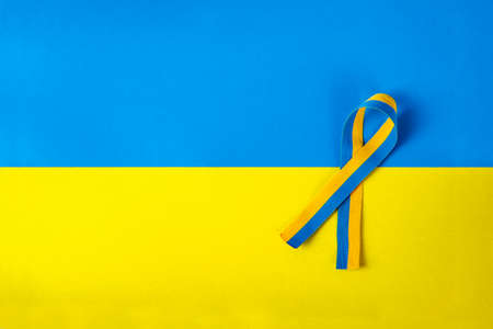 Yellow-blue (colors of the Ukrainian flag) cardboard photographed from aboveの写真素材