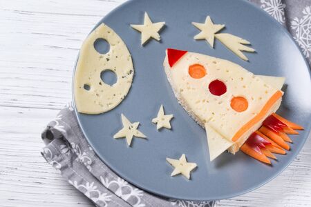 Funny sandwich with rocket and stars made of cheese, carrot and paprika, meal for kids ideaの写真素材