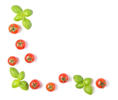 Beautiful frame made of fresh cherry tomatoes with basil leaves, isolated on white background, vegetable pattern, top viewの写真素材