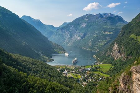 Beautiful view to Geiranger fjord with cruise ship and waterfall, Norwayの写真素材