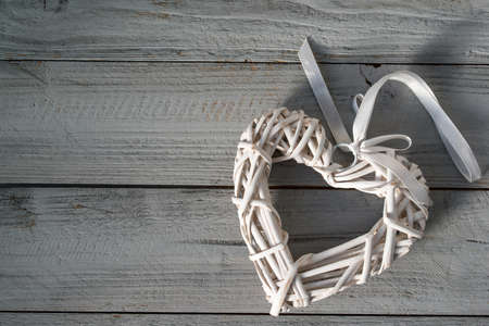 Valentines day background, white hearts on a light gray wooden backgroundの写真素材