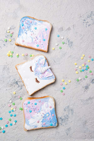 Unicorn or mermaid toasts with stars, food for kids idea, top viewの写真素材
