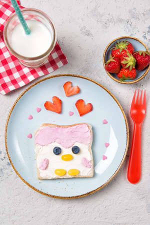 Penguin toast with pink spread on a plate, food for kids ideaの写真素材