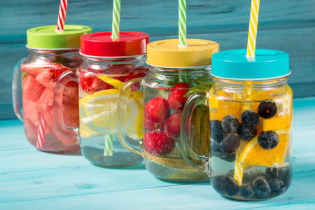Assorted detox water cocktails in glass jars