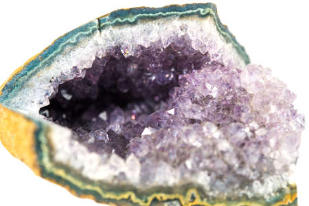 Amethyst stone cut, druses of the crystals isolated on white backgroundの写真素材