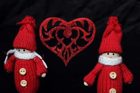 two lovers toy boy and girl on a very dark backgroundの写真素材