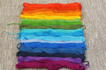 Colorful cotton craft threads on burlapの写真素材
