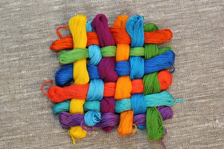 Colorful cotton craft threads on burlap