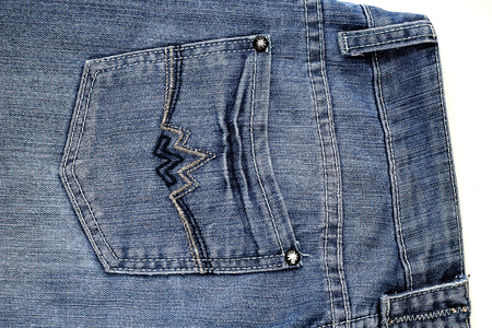 blue jeans pocket with rivets closeup