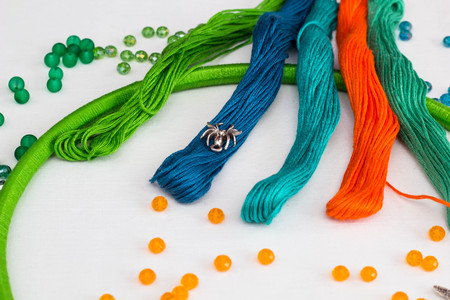 set for making a Dreamcatcher, beads, thread on a white backgroundの写真素材