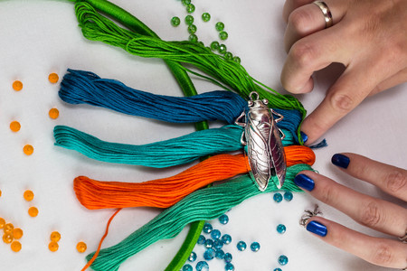 set for making a Dreamcatcher, beads, thread on a white backgroundの写真素材