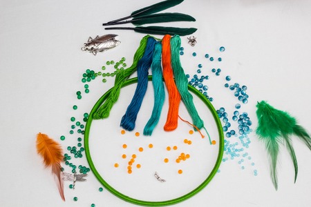 set for making a Dreamcatcher, beads, thread on a white backgroundの写真素材