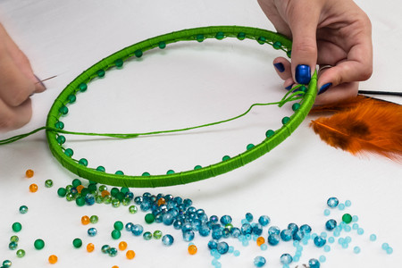 set for making a Dreamcatcher, beads, thread on a white backgroundの写真素材