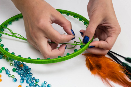 set for making a Dreamcatcher, beads, thread on a white backgroundの写真素材