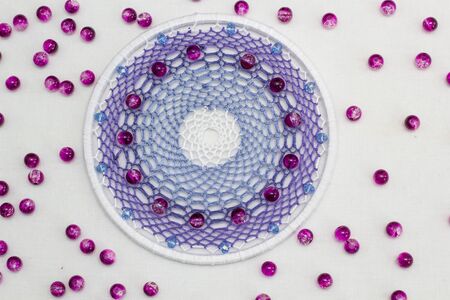 Beautiful lilac dream catcher on white backgroundの写真素材