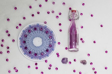 Beautiful lilac dream catcher on white background