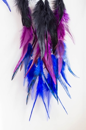 photo of a dreamcatcher made by hand, with using threads, beads and feathers roosterの写真素材