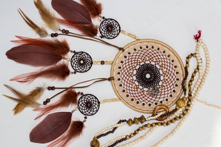 Dreamcatcher made of feathers leather beads and ropes, hangingの写真素材