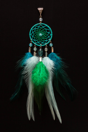 Dreamcatcher made of feathers leather beads and ropes, hangingの写真素材