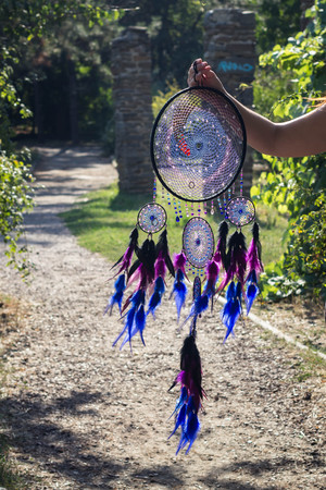 Dreamcatcher made of feathers leather beads and ropes, hangingの写真素材