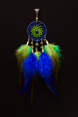 Dreamcatcher made of feathers leather beads and ropes, hangingの写真素材