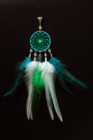 Dreamcatcher made of feathers leather beads and ropes, hangingの写真素材