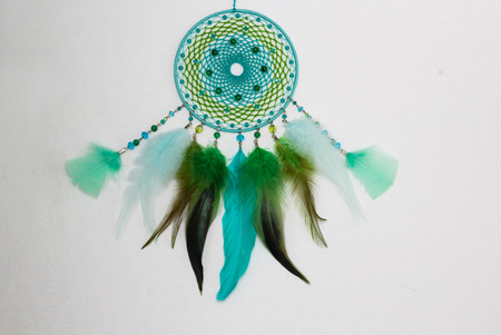 Dreamcatcher made of feathers leather beads and ropes, hangingの写真素材