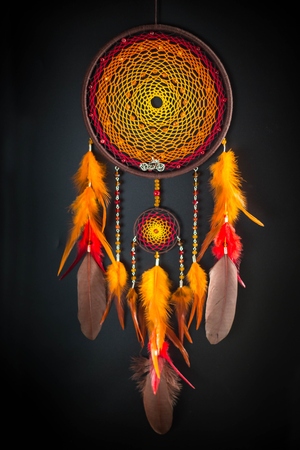Dreamcatcher made of feathers leather beads and ropes, hangingの写真素材