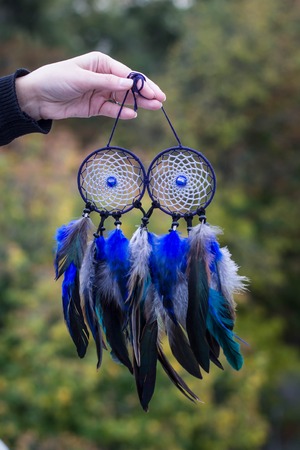 Dreamcatcher made of feathers leather beads and ropes, hangingの写真素材