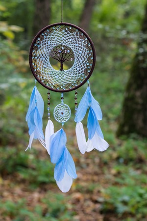 Dreamcatcher made of feathers leather beads and ropes, hangingの写真素材