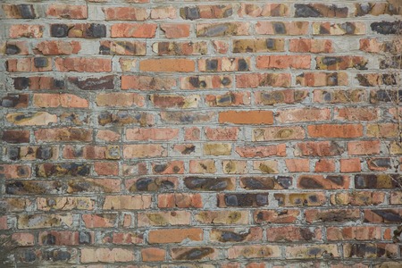 Background of old orange brick wall textureの写真素材