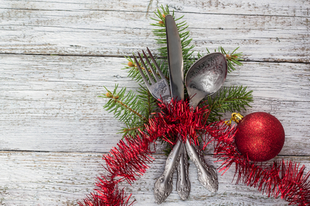 Christmas empty wooden table with knife, fork and spoonの写真素材