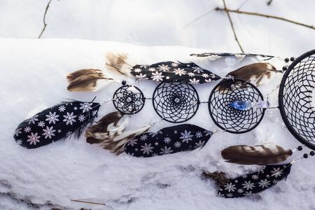 Dreamcatcher made of feathers, leather, beads, and ropesの写真素材