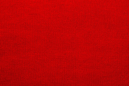 The texture of a knitted woolen fabric red. Backgroundの写真素材