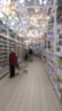Blurred image of people in shopping mall with bokehの写真素材