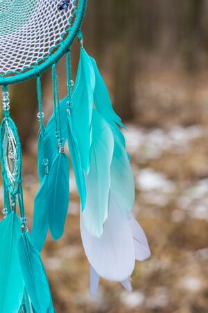 Dreamcatcher made of feathers leather beads and ropes, hangingの写真素材
