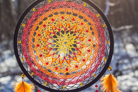 Colorful Dreamcatcher made of feathers leather beads and ropes, hanging, handmadeの写真素材