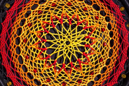 Colorful Dreamcatcher made of feathers leather beads and ropes, hanging, handmadeの写真素材