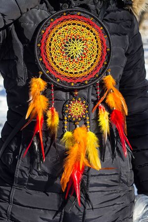 Colorful Dreamcatcher made of feathers leather beads and ropes, hanging, handmadeの写真素材