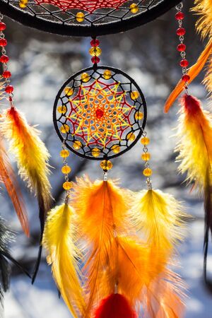 Colorful Dreamcatcher made of feathers leather beads and ropes, hanging, handmadeの写真素材