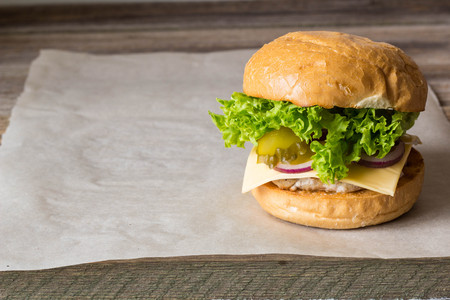 Close-up of home made tasty burgers on wooden table.の写真素材