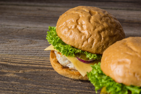 Close-up of home made tasty burgers on wooden table.の写真素材