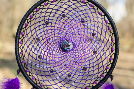 Colorful Dreamcatcher made of feathers leather beads and ropes, hanging, handmadeの写真素材