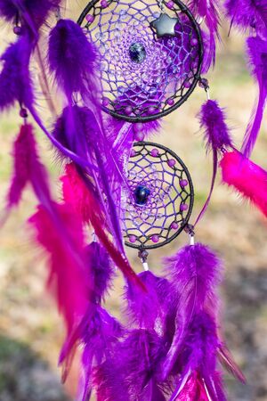 Colorful Dreamcatcher made of feathers leather beads and ropes, hanging, handmadeの写真素材