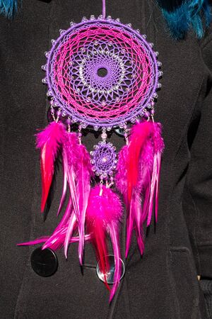 Colorful Dreamcatcher made of feathers leather beads and ropes, hanging, handmadeの写真素材