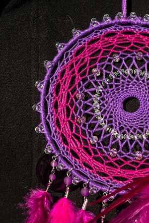 Colorful Dreamcatcher made of feathers leather beads and ropes, hanging, handmadeの写真素材