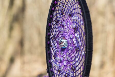 Colorful Dreamcatcher made of feathers leather beads and ropes, hanging, handmadeの写真素材