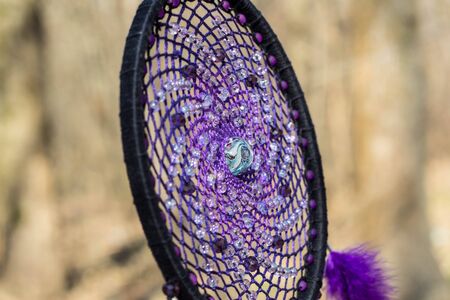 Colorful Dreamcatcher made of feathers leather beads and ropes, hanging, handmadeの写真素材