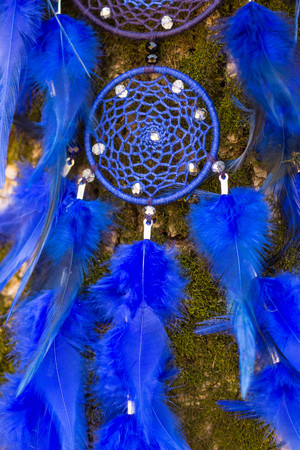 Colorful Dreamcatcher made of feathers leather beads and ropes, hanging, handmadeの写真素材