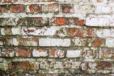 empty old brick wall texture. Shabby building facade with damaged plaster, copy space.の写真素材